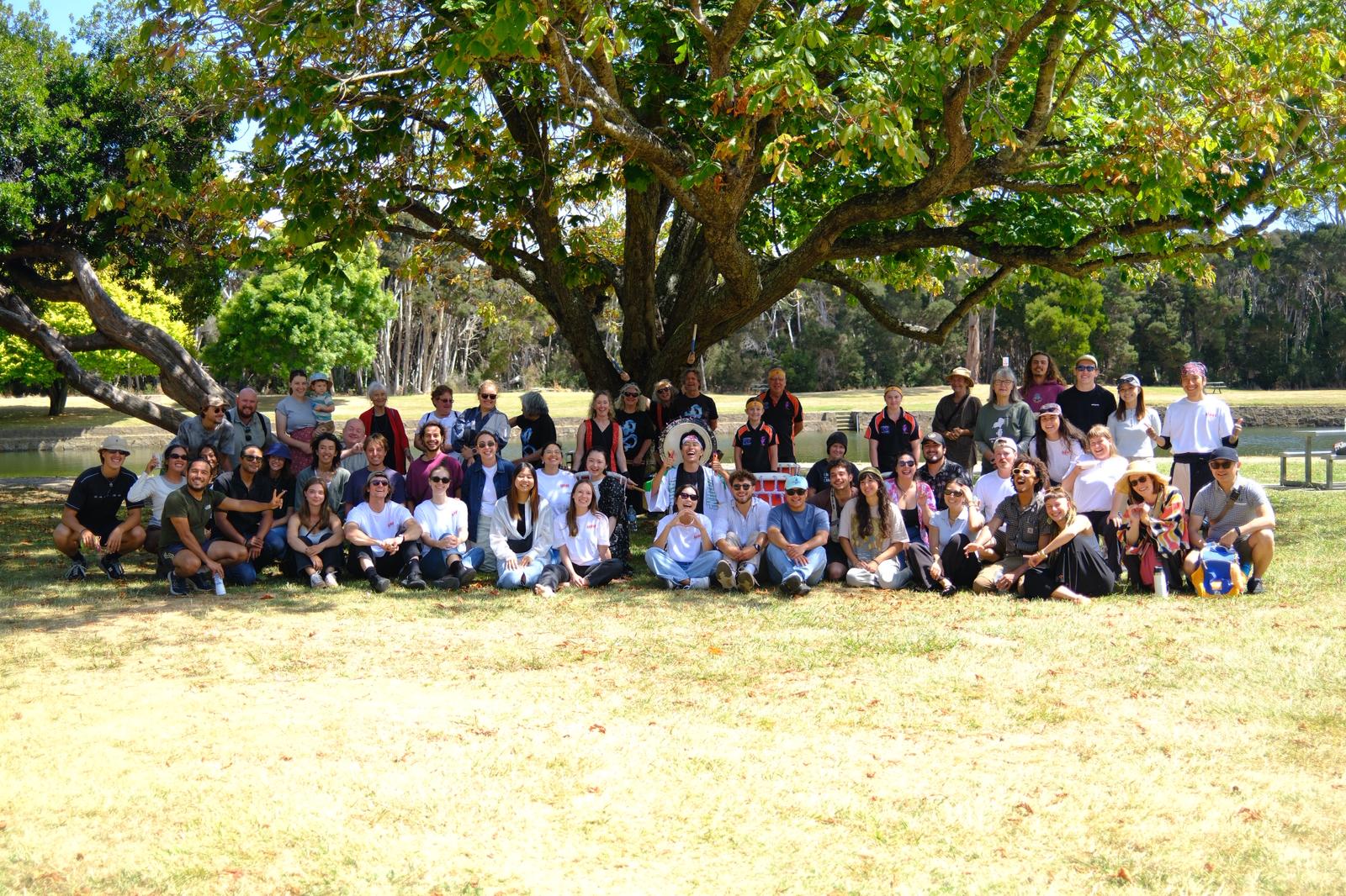 Japanese ARAWA Festival — group photo with all participants under a tree